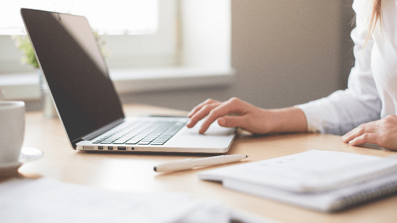 recruiter setting up the recruiting process using a laptop