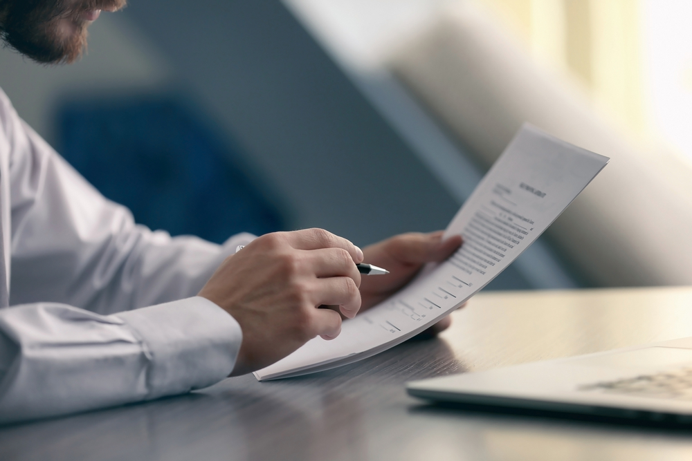 man reading a document