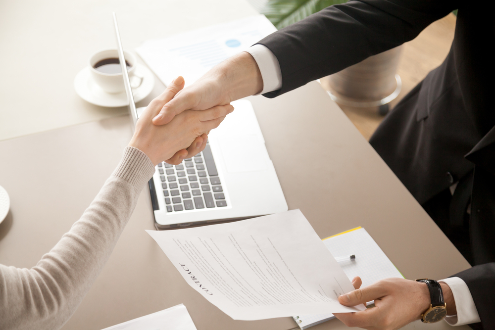 recruiter and applicant shaking hands