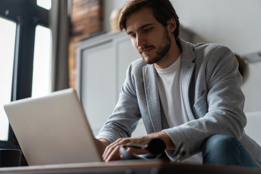 male boss in a work from home setup, fixing the new hire onboarding checklist