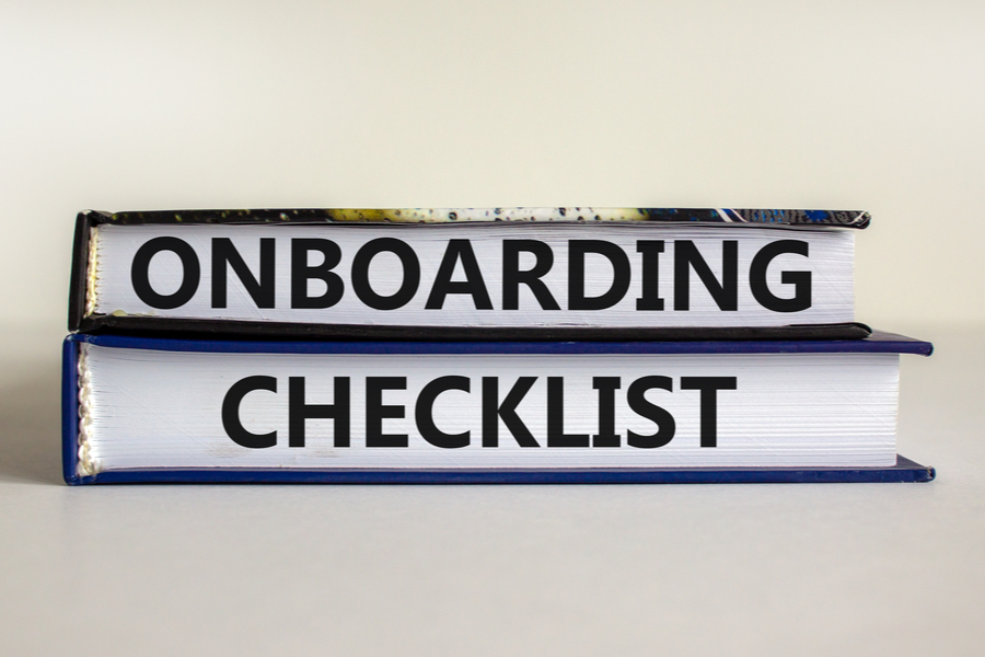 onboarding checklist written on the pages of two books