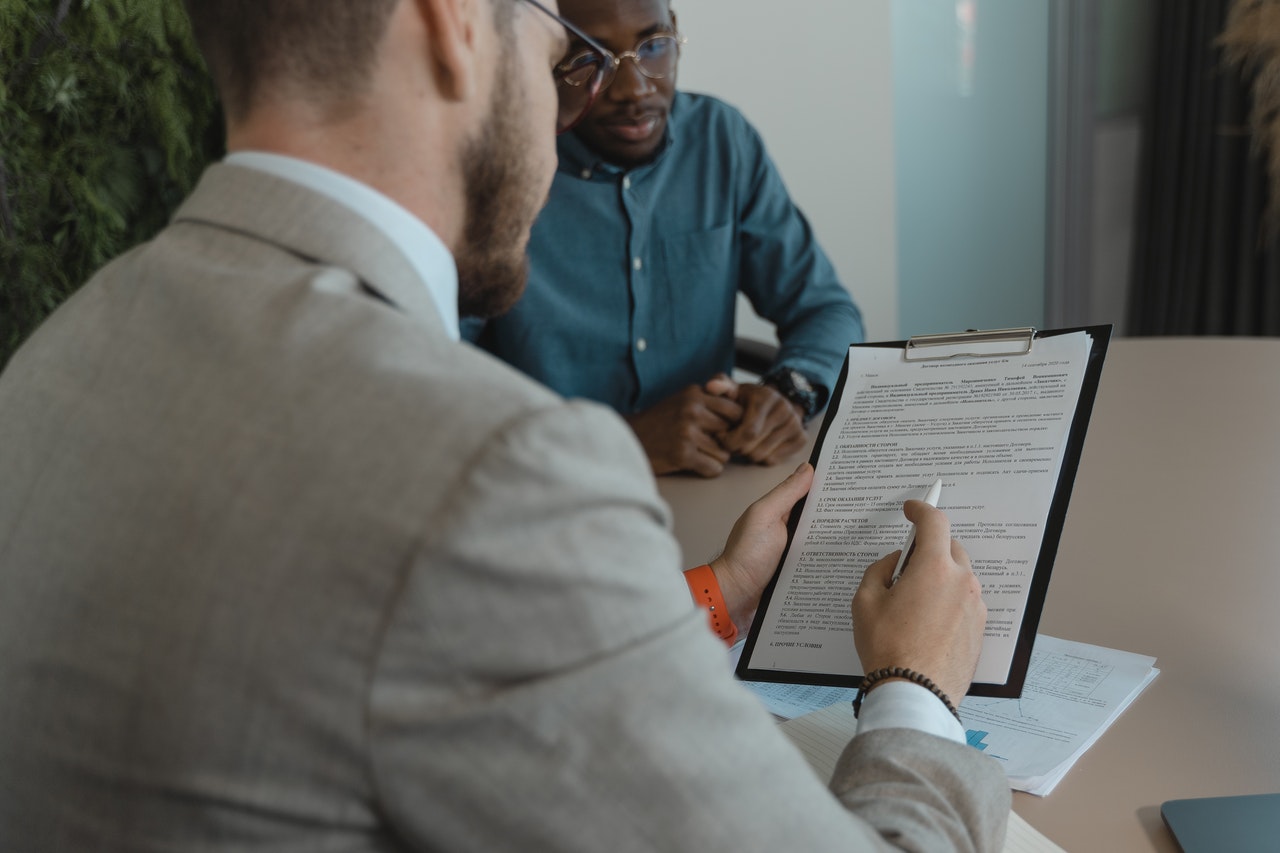 An interviewer reading an interview guide