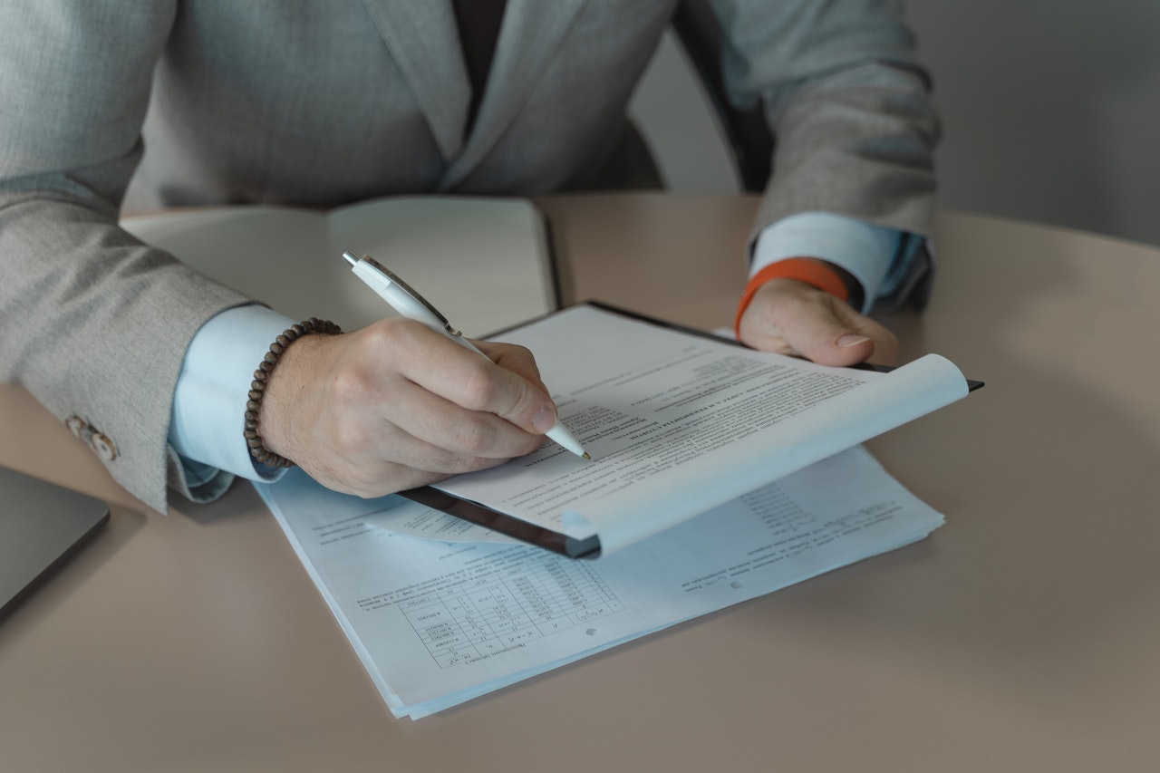 a person reading a form on a clipboard