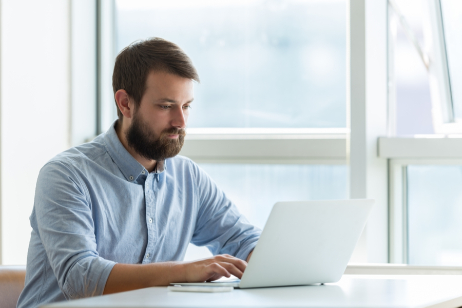 man making his resume using relevant keywords