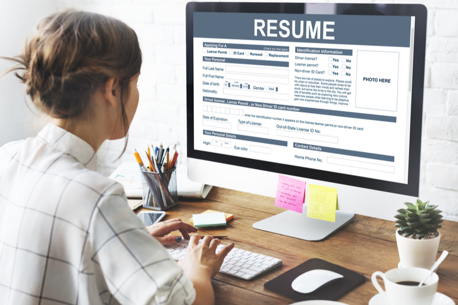 woman making her resume using a template