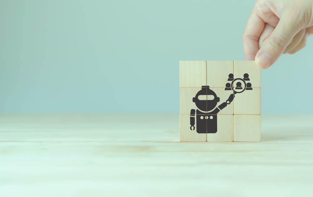 wooden blocks of artificial intelligence in recruiting process concept