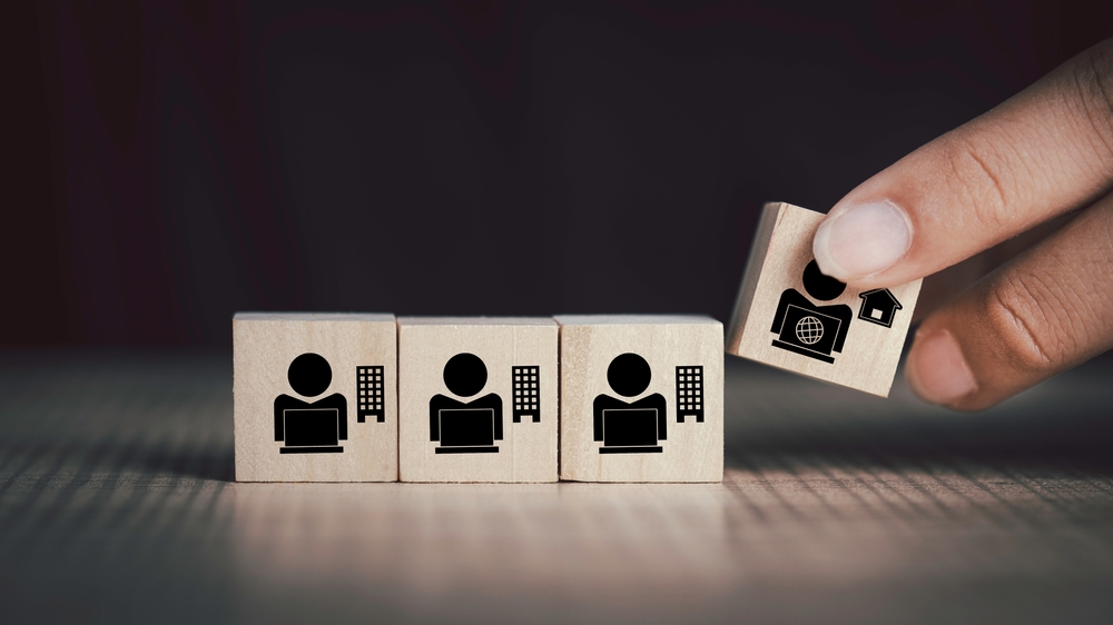 one freelancer and three corporate employees wooden blocks