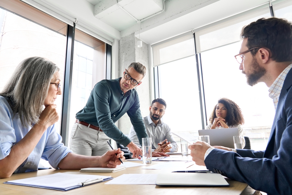 male employee discussing in a corporate meeting