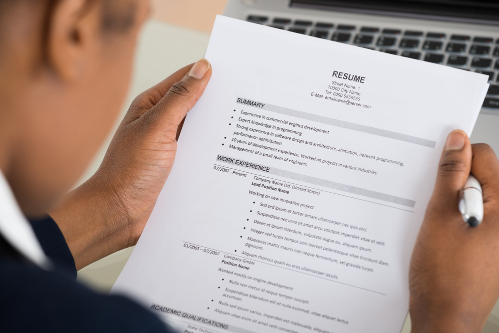 male recruiter reading a resume