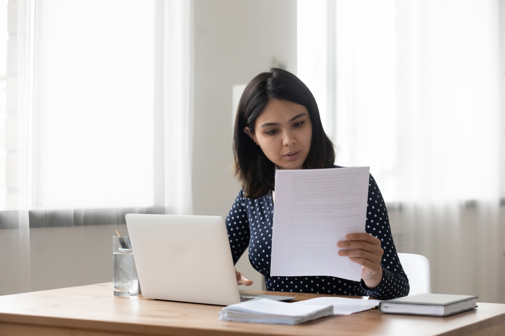 female HR reading a resume