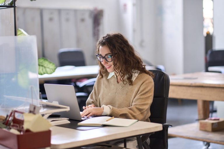 female intern working at her desk