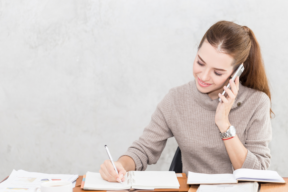 woman talking to someone over the phone