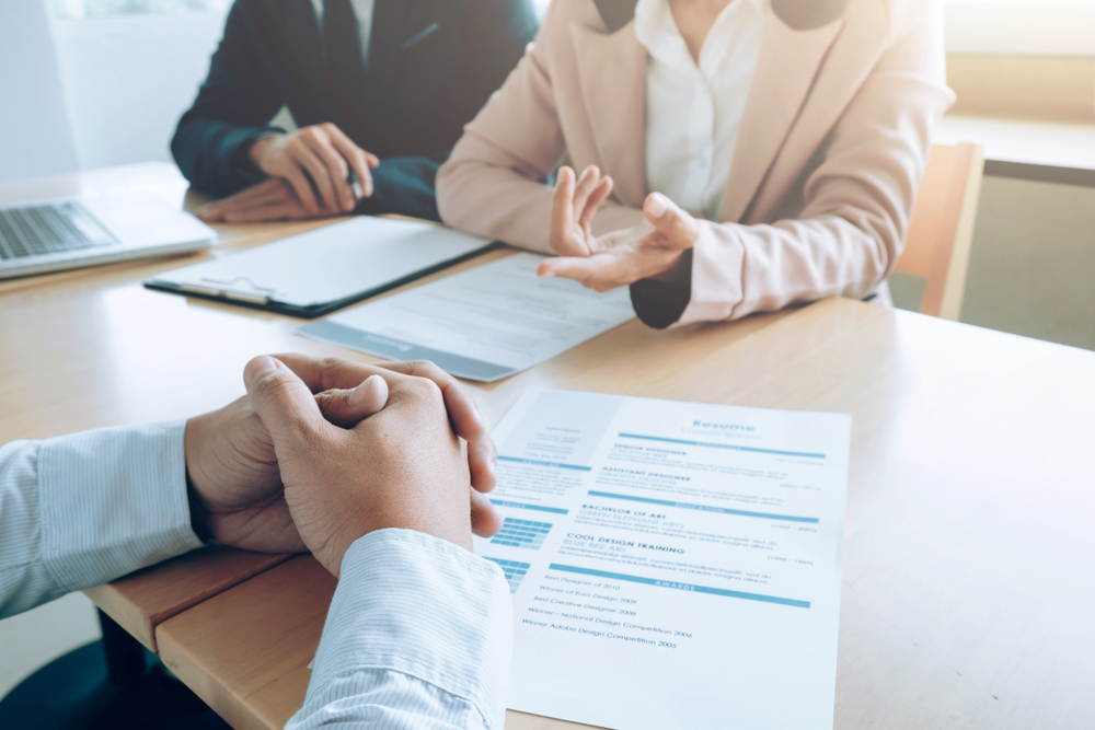 recruiters interviewing an applicant